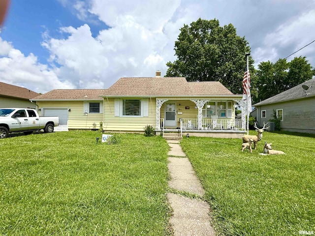1313 N State St, Marion, IL 62959 - view of front of house with covered porch, an attached garage, a front lawn, and a chimney