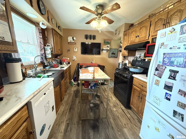 1313 N State St, Marion, IL 62959 - kitchen featuring white appliances, dark wood-style floors, under cabinet range hood, light countertops, and brown cabinetry