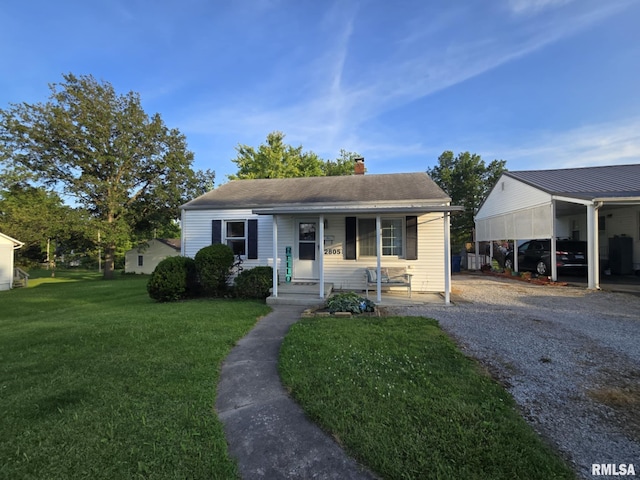 2805 College St, Mount Vernon, IL 62864 - view of front of property featuring a porch, a chimney, a front yard, and gravel driveway
