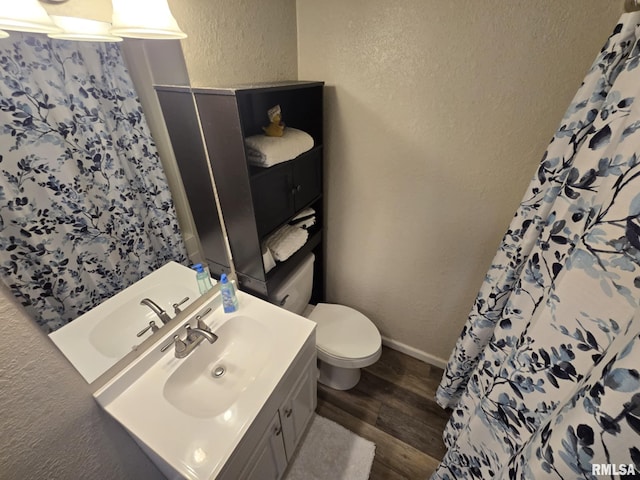 2805 College St, Mount Vernon, IL 62864 - full bathroom with a textured wall, wood finished floors, vanity, and a shower with curtain