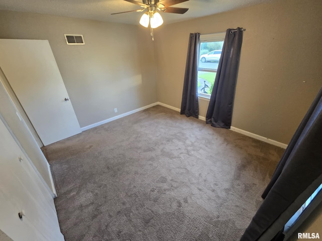 2805 College St, Mount Vernon, IL 62864 - spare room featuring a ceiling fan and carpet flooring