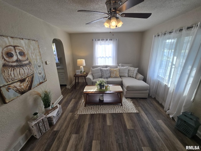 2805 College St, Mount Vernon, IL 62864 - living room featuring a textured wall, arched walkways, a textured ceiling, ceiling fan, and wood finished floors