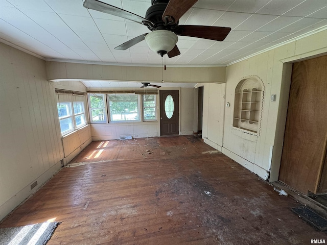 9004 Old State Route 14th Rte, Duquoin, IL 62832 - unfurnished living room with ornamental molding, ceiling fan, wood walls, and wood finished floors