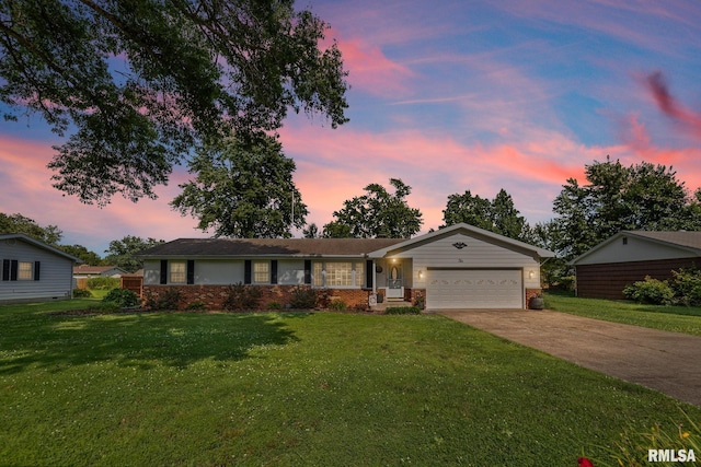10 Monroe Ave, Salem, IL 62881 - ranch-style house with a garage, driveway, a yard, and brick siding