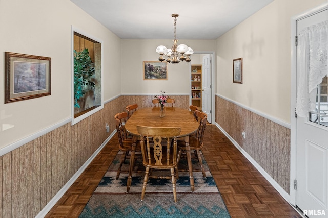 10 Monroe Ave, Salem, IL 62881 - dining area featuring wainscoting, a chandelier, and wood walls