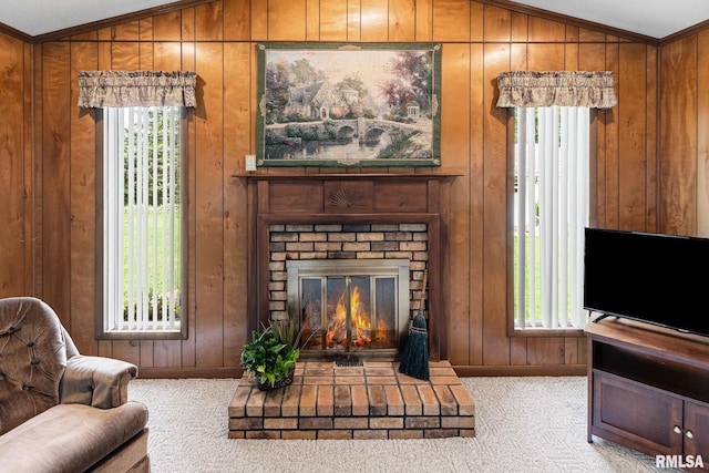 10 Monroe Ave, Salem, IL 62881 - carpeted living area featuring vaulted ceiling, plenty of natural light, wooden walls, a fireplace, and crown molding