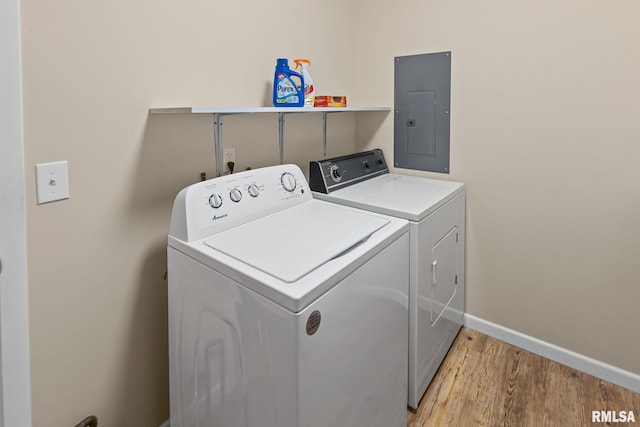 10 Monroe Ave, Salem, IL 62881 - washroom with electric panel, separate washer and dryer, and light wood-type flooring