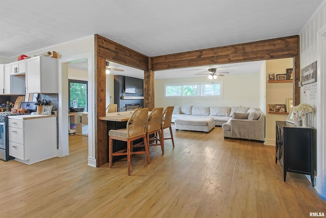 809 Dogwood Ln, Marion, IL 62959 - dining space featuring a ceiling fan, light wood-style floors, plenty of natural light, and crown molding
