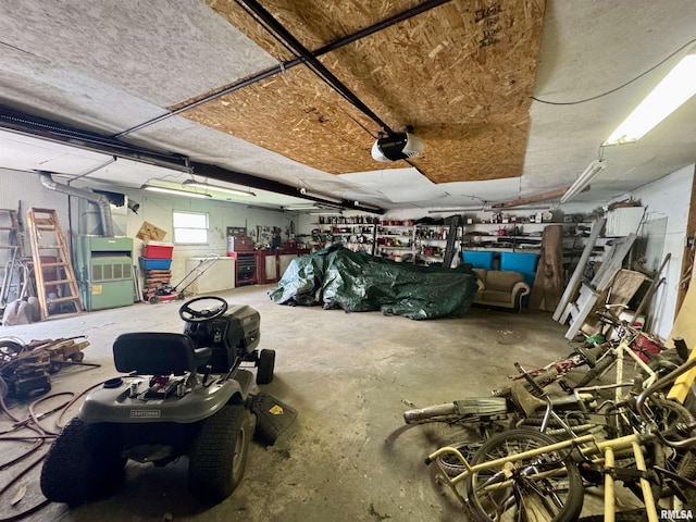 606 N Orchard St, West Frankfort, IL 62896 - garage featuring a garage door opener and a workshop area