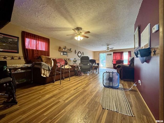 606 N Orchard St, West Frankfort, IL 62896 - living room featuring a ceiling fan, wood finished floors, and a textured ceiling