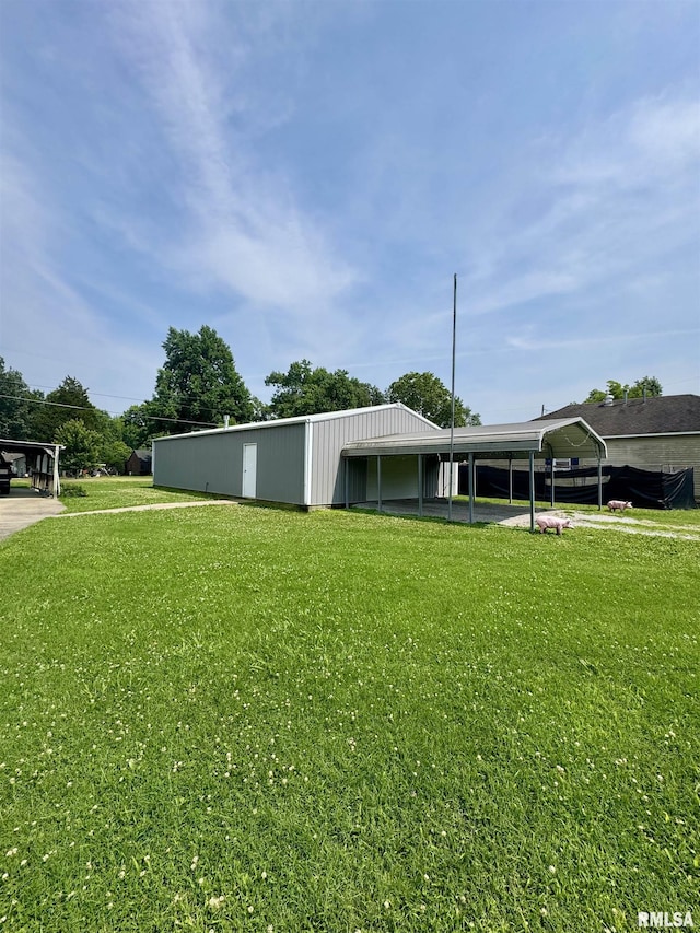 606 N Orchard St, West Frankfort, IL 62896 - view of grassy yard with a pole building and an outdoor structure