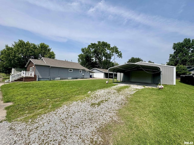 606 N Orchard St, West Frankfort, IL 62896 - back of property featuring a carport, driveway, and a lawn