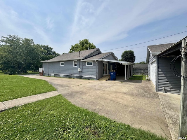 606 N Orchard St, West Frankfort, IL 62896 - rear view of house with a lawn and a shingled roof