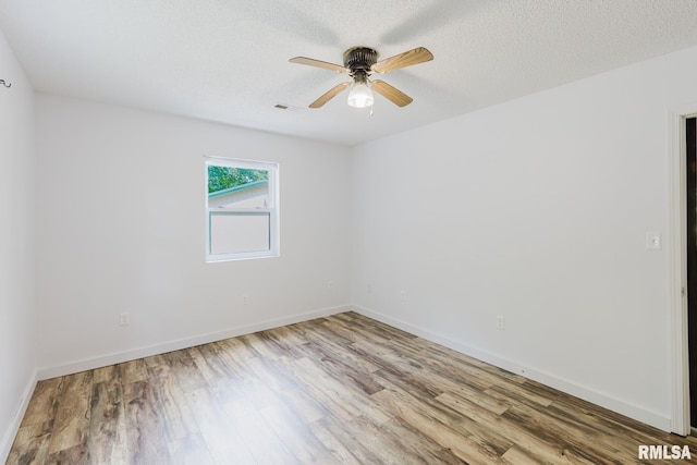 880 State Route 166, Creal Springs, IL 62922 - empty room featuring wood finished floors, a ceiling fan, and a textured ceiling