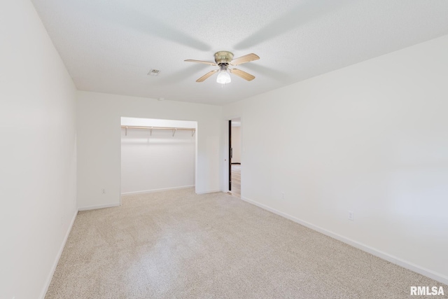 880 State Route 166, Creal Springs, IL 62922 - unfurnished bedroom featuring light carpet, a ceiling fan, and a closet