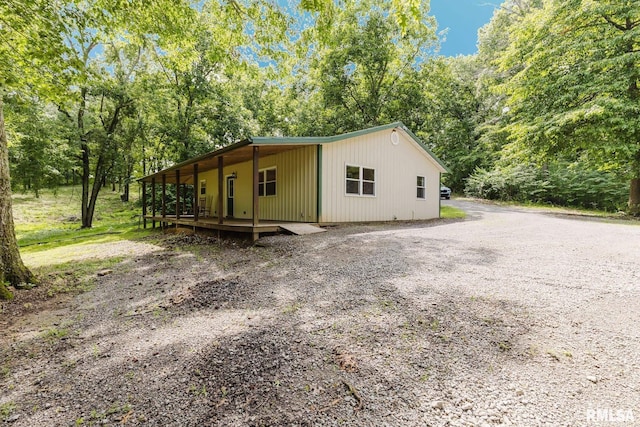 880 State Route 166, Creal Springs, IL 62922 - view of front facade with a deck and view of scattered trees