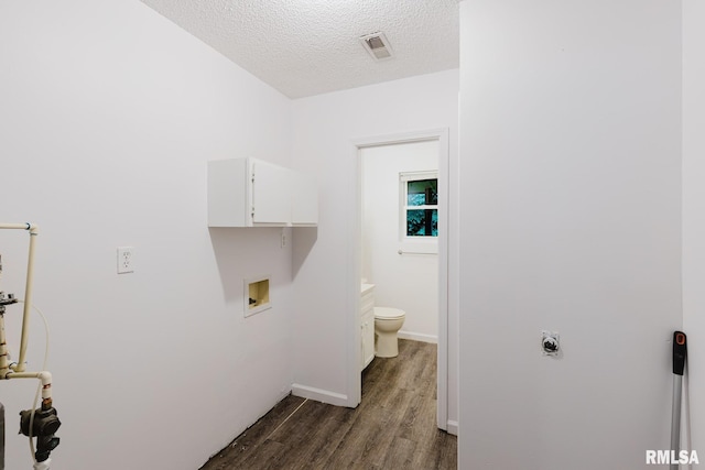 880 State Route 166, Creal Springs, IL 62922 - washroom featuring dark wood-style flooring, a textured ceiling, washer hookup, and electric dryer hookup