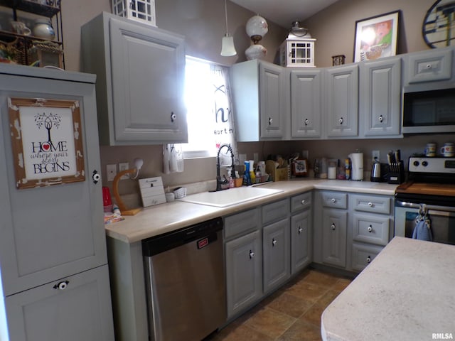 1821 Mark Dr, Sparta, IL 62286 - kitchen featuring stainless steel appliances, light countertops, gray cabinets, and pendant lighting