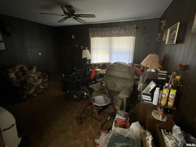 1205 W Bennett St, Salem, IL 62881 - living room featuring wood walls, ceiling fan, and carpet floors