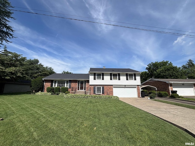49 Jon St, Metropolis, IL 62960 - tri-level home featuring brick siding, concrete driveway, a front yard, and a garage
