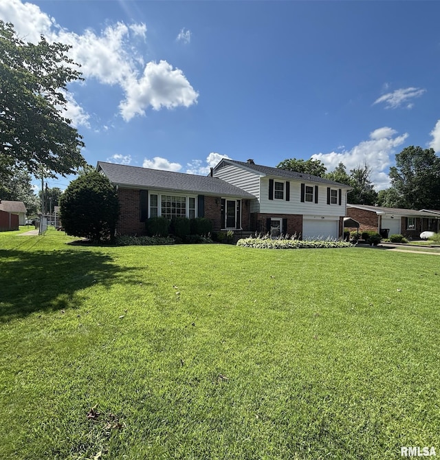 49 Jon St, Metropolis, IL 62960 - split level home featuring brick siding, a front yard, and a garage