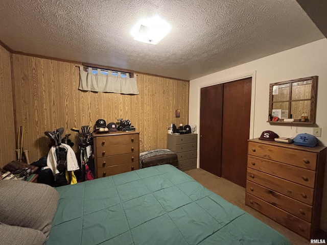 49 Jon St, Metropolis, IL 62960 - carpeted bedroom featuring wood walls, a closet, and a textured ceiling
