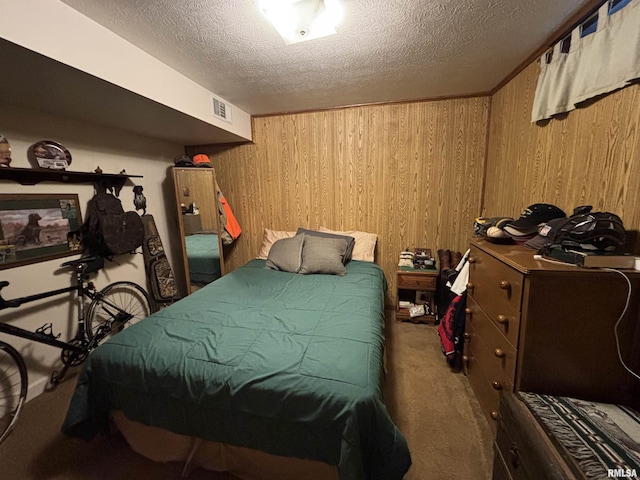 49 Jon St, Metropolis, IL 62960 - carpeted bedroom with wooden walls and a textured ceiling