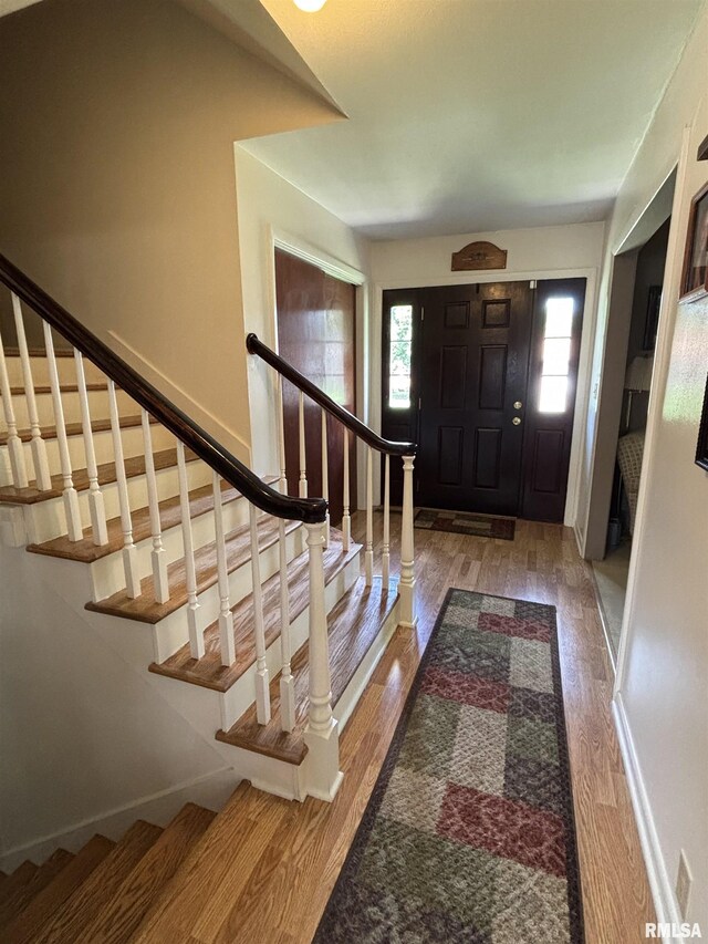 49 Jon St, Metropolis, IL 62960 - foyer entrance with wood finished floors and stairs