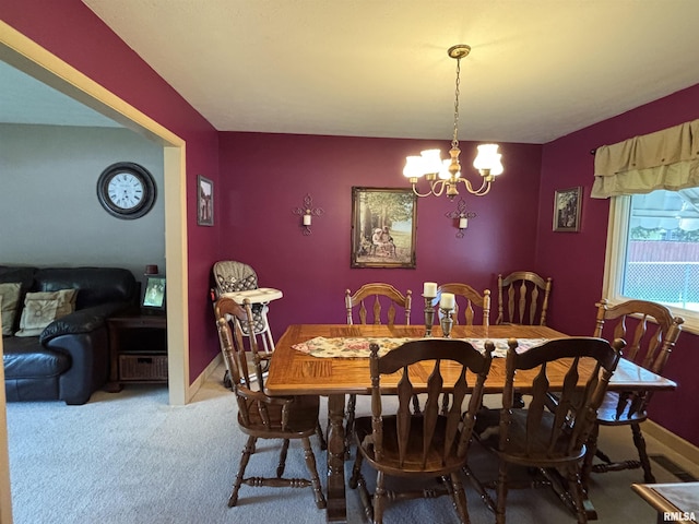 49 Jon St, Metropolis, IL 62960 - carpeted dining area with a chandelier and baseboards