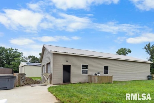 1615 Posey St, Marion, IL 62959 - view of home's exterior with an outdoor structure and a metal roof