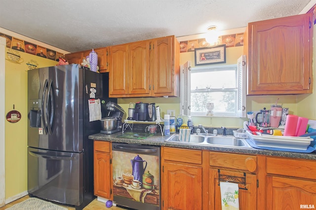 735 Sharp Rd, Anna, IL 62906 - kitchen with refrigerator with ice dispenser, dishwasher, dark countertops, a textured ceiling, and brown cabinets
