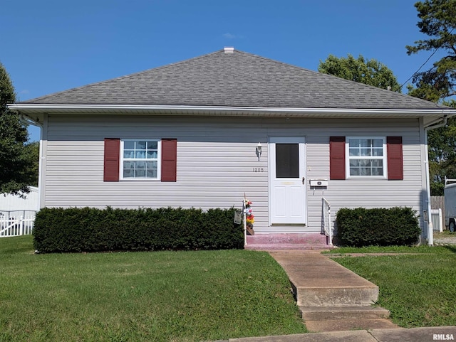 1205 Burgess Ave, Johnston City, IL 62951 - bungalow-style house with a front lawn and roof with shingles