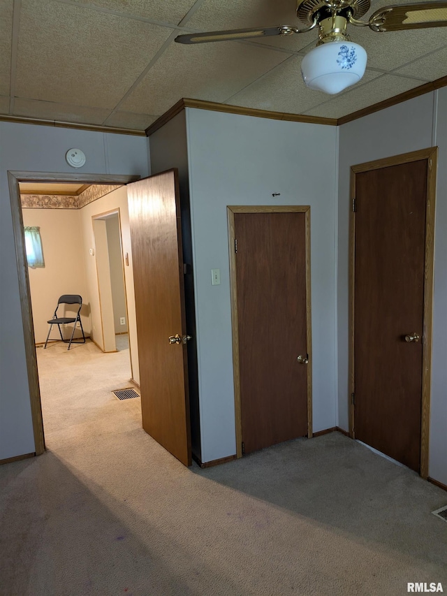 1205 Burgess Ave, Johnston City, IL 62951 - unfurnished bedroom featuring carpet floors, crown molding, and a ceiling fan