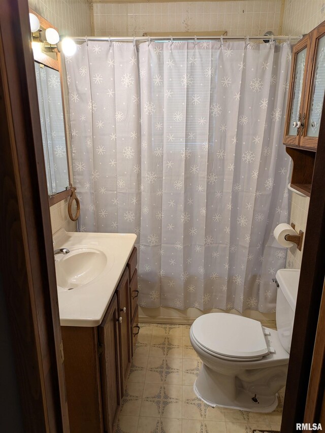 1205 Burgess Ave, Johnston City, IL 62951 - bathroom with vanity and a shower with curtain