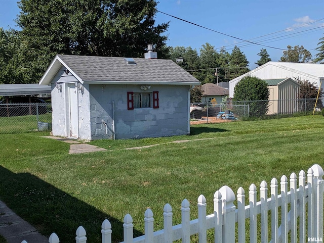1205 Burgess Ave, Johnston City, IL 62951 - fenced backyard featuring a storage shed