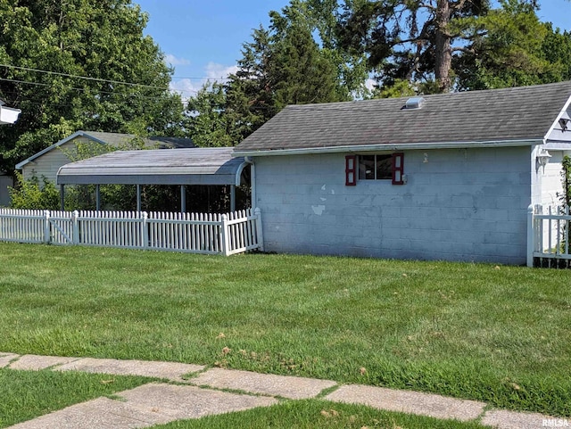 1205 Burgess Ave, Johnston City, IL 62951 - view of property exterior with concrete block siding and a shingled roof