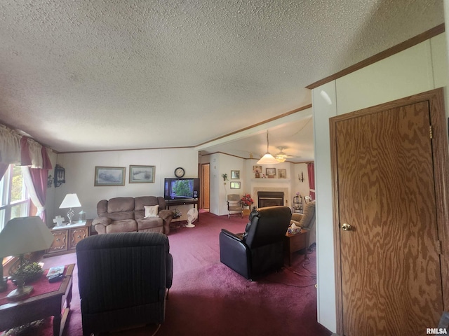8747 Old State Route 14th Rte, Duquoin, IL 62832 - living room with carpet flooring, a textured ceiling, ornamental molding, a fireplace, and a ceiling fan