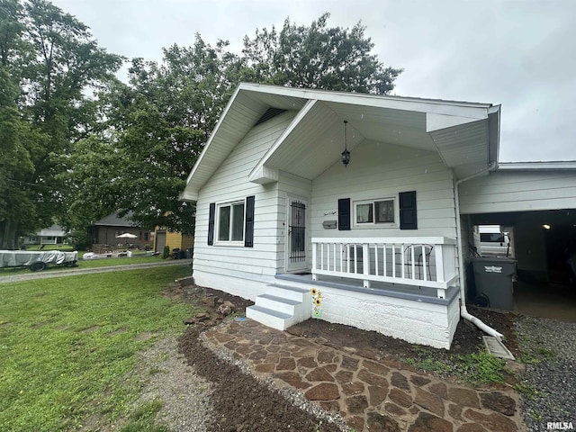 308 Blossom St, Carterville, IL 62918 - view of front of property featuring covered porch and a front lawn