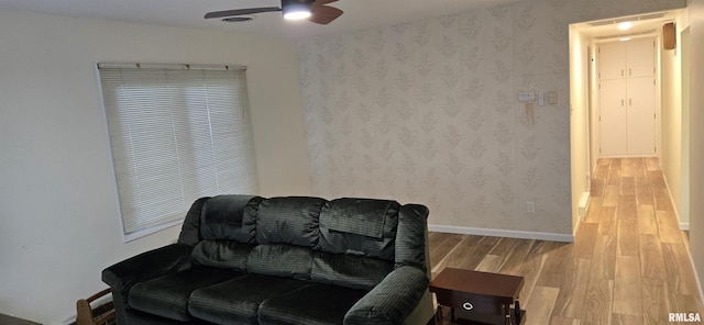 308 Blossom St, Carterville, IL 62918 - living area featuring wood finished floors, ceiling fan, and wallpapered walls