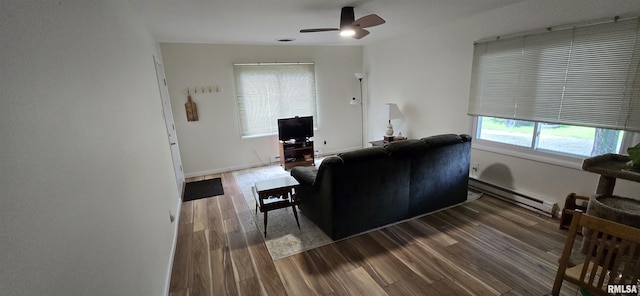 308 Blossom St, Carterville, IL 62918 - living room with a baseboard heating unit, ceiling fan, and wood finished floors