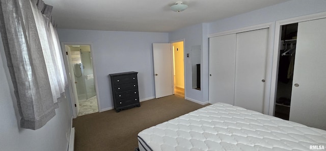 308 Blossom St, Carterville, IL 62918 - bedroom featuring dark carpet, two closets, and connected bathroom