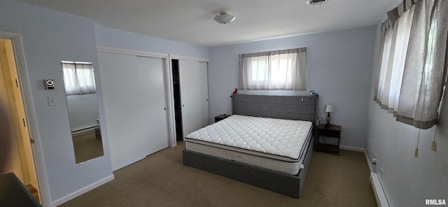308 Blossom St, Carterville, IL 62918 - bedroom featuring multiple closets, carpet, and baseboard heating