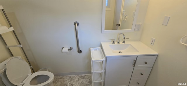 308 Blossom St, Carterville, IL 62918 - half bathroom featuring toilet and vanity