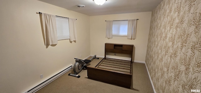 308 Blossom St, Carterville, IL 62918 - unfurnished bedroom featuring a baseboard heating unit and carpet floors