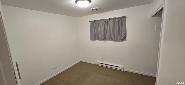 308 Blossom St, Carterville, IL 62918 - empty room featuring a baseboard radiator and dark colored carpet