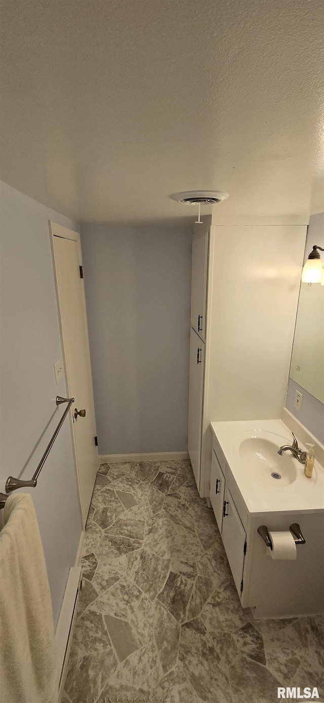 308 Blossom St, Carterville, IL 62918 - bathroom with vanity and a textured ceiling