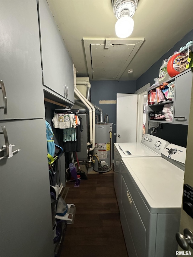 525 N St, Murphysboro, IL 62966 - washroom with attic access, water heater, cabinet space, washer and clothes dryer, and dark wood-style flooring