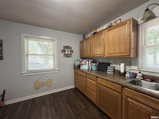 525 N St, Murphysboro, IL 62966 - kitchen featuring dark countertops, dark wood-style floors, and brown cabinets
