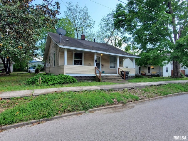307 W Sycamore St, Carbondale, IL 62901 - bungalow-style house featuring a porch and a chimney
