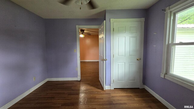 711 Mclean St, Rosiclare, IL 62982 - unfurnished bedroom featuring wood finished floors and ceiling fan